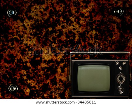 Old tv box with grunge antique metal background