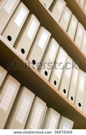 A shelf and a lot of catalogs filled with documents
