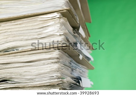 There are documents and papers on green background