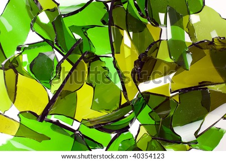 A composition of broken bottle glass, main color is green