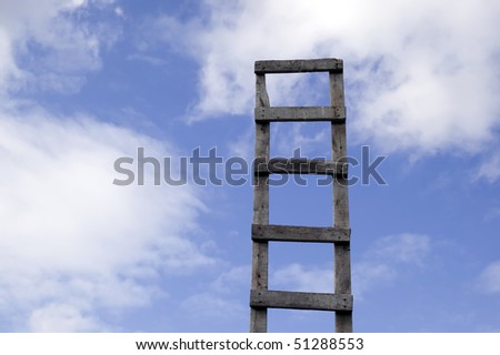 Old antique ladder to blue beautiful heaven