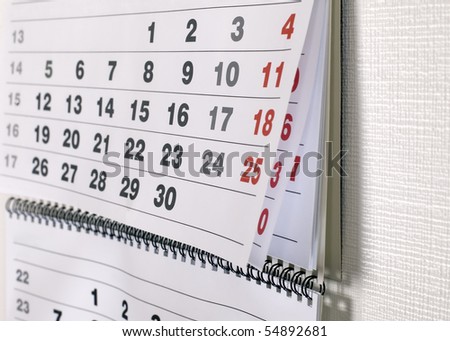stock-photo-calendar-with-dates-of-month-is-hanging-on-the-wall-54892681.jpg