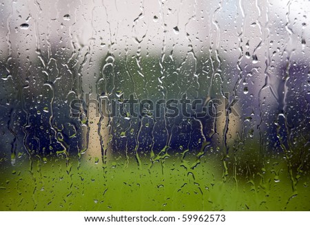 View through the window to garden of house, raining