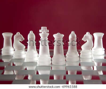 Game for leisure chess with figures on red background