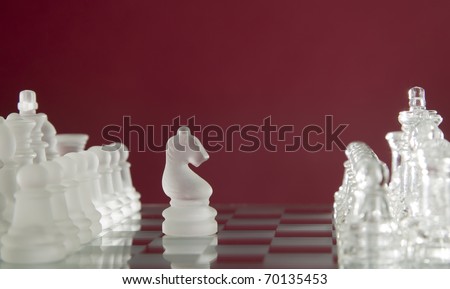 Game for leisure chess with figures on red background
