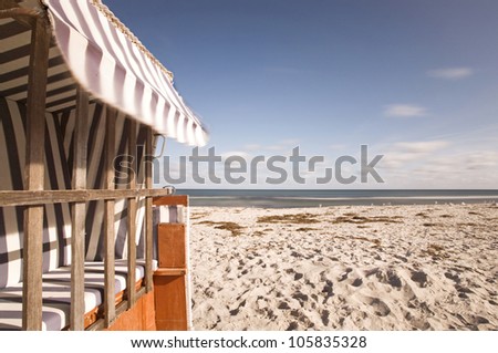 detail of Hooded Beach chair at a beach on the baltic sea coast, beach chair at with baltic sea at background
