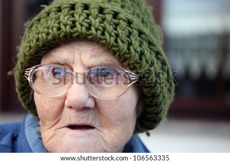 portrait of a senior woman with a winter cap outdoor