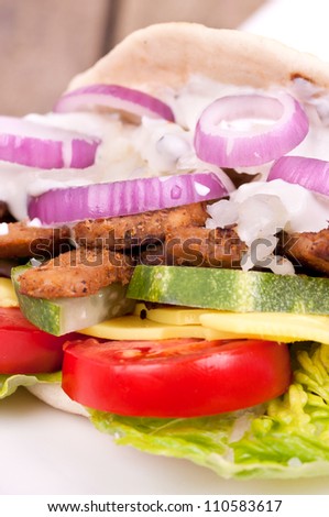 Doner kebab with fresh vegetables, gyros in bread
