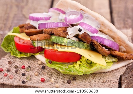 Doner kebab with fresh vegetables, gyros in bread