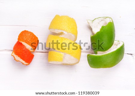 peel of lemon, tangerines and pomelo side by side, clementine, lemon, pomelo, orange, yellow, green
