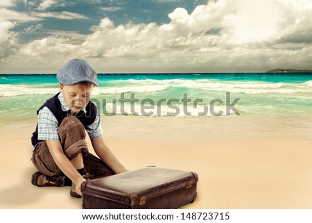 Young Boy opened a case with a pirates treasure at the beach, kid with case at the beach Retro style