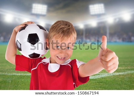 smiling Soccer fan with Soccer ball in stadium