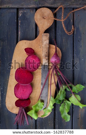 Fresh picked organic beetroot on old rustic wooden board, birdÃ?Â´s eye view