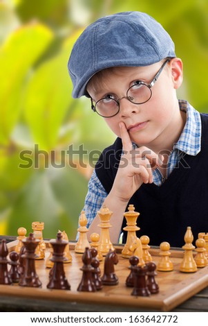small chess player thinking about the next step, outside