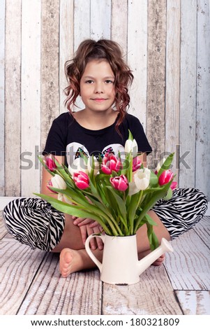 cool young girl with a bouquet tulips, joy of life in springtime