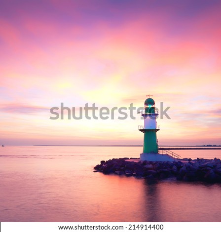 Beautiful seascape with lighthouse on sunrise