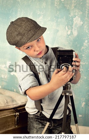 child with camera - Retro look, Young photographer with a camera - vintage style