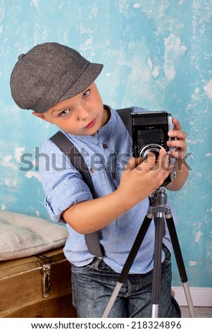 child with camera - Retro look, Young photographer with a camera - vintage style