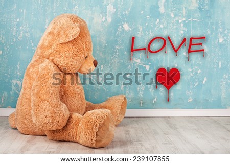 Teddy Bear with red heart. Valentines Day concept. Old toys