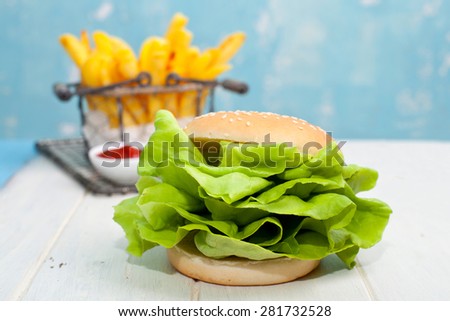 vegetarian burger with fresh green salad - healthy eating