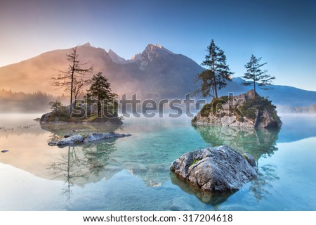 Misty summer morning on the Hintersee lake in Austrian Alps