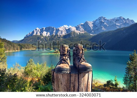 beautiful lake view to eibsee and Zugspitze with hiking boots