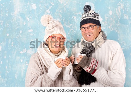 Senior couple with winter clothes and Cup of tea
