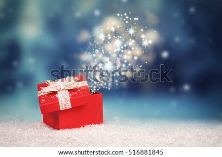 Magic Christmas gift box, opened gift box with stars and light, surprise
