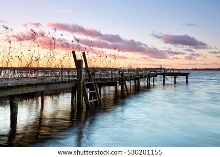 jetty sunset, wooden Pier on the lake, winter