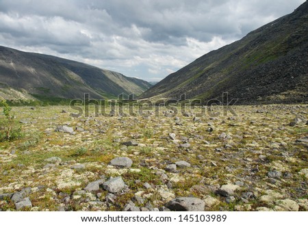 Landscape with Mountains, Stones and Stormy Clouds. Tundra of Lovozerie, Russia