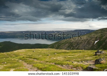 Mountain Landscape with Road and Lake over the Distance. Tundra of Lovozerie, Russia