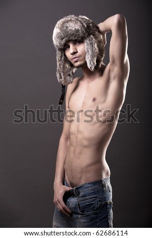 stock photo Halfnaked gay guy posing in a busby