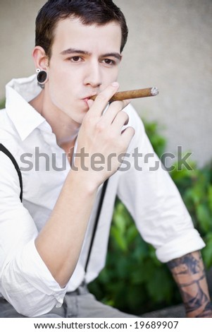 man thinks while smoking cigar