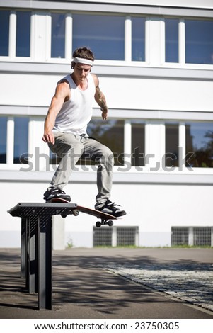 skater making a slide with his skateboard