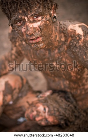 couple playing in the mud