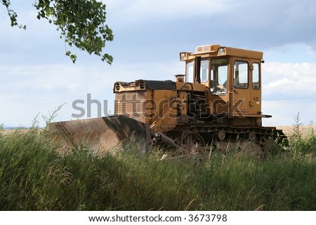 Front Loader sits in grass