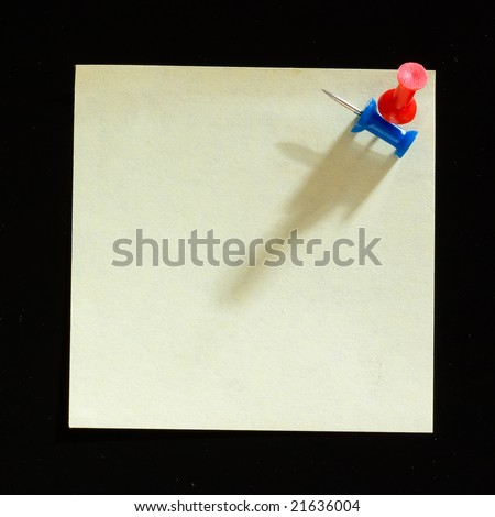 Yellow sticker note isolated on the black background