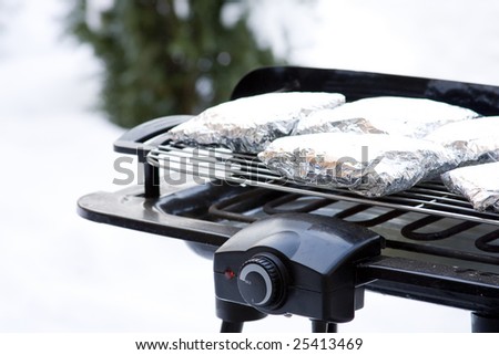 Barbecue grill covered in Snow