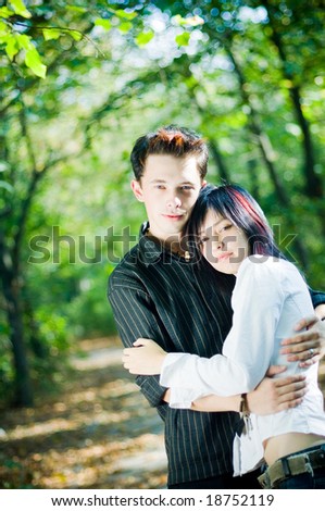 Young people hugging outdoors