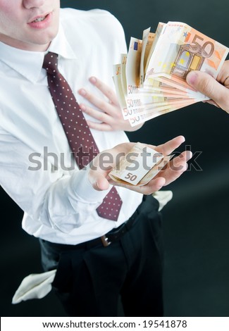 Businessman receiving money, isolated on black background