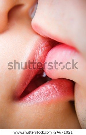 Close-up of kissing lips, selective focus