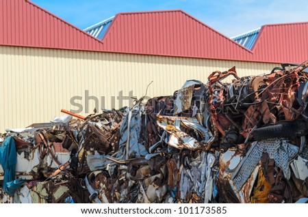 Piles of metal junk, car parts and all kind of old and rusty iron and steel pieces.