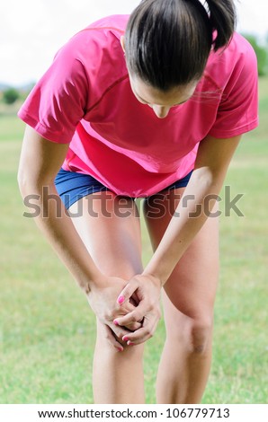 Knee pain. Female athlete with leg sport muscle lesion. Running injury concept.