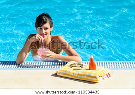 Woman drinking soda in swimming pool. Caucasian beautiful girl into water on summer. Copy space.