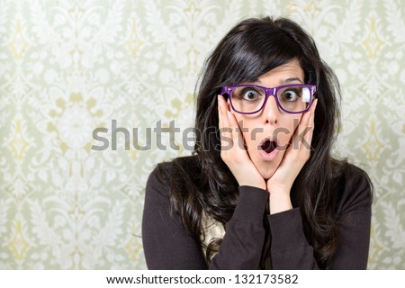 Afraid woman surprise face expression. Caucasian brunette girl, mouth open and hands on face.