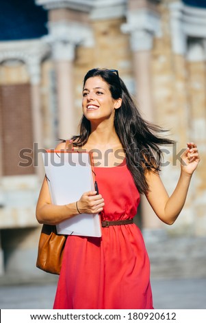 Successful female student at college. Young woman education success in european university.