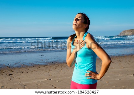 Exhausted female runner suffering painful angina pectoris or asthma breathing problems after training hard on summer. Running overtraining consequence.
