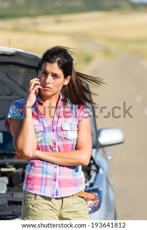 Upset desperate woman calling to car insurance service after accident or engine breakdown. Roadtrip vacation problem concept.