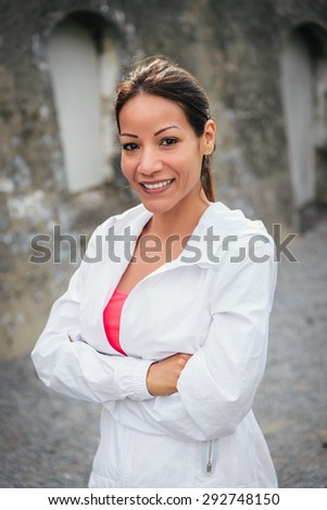Motivated and confident female athlete portrait. Sporty woman with arms crossed. Motivation and fitness lifestyle.