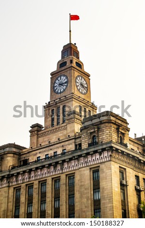 Old Customs Building with Clock and Flag, The  Bund, Shanghai, China.  The Customs Building was built in 1927.